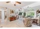 Bright living room boasting high ceilings, ceiling fan, and a cozy fireplace at 35 Misners Trl, Ormond Beach, FL 32174