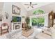 Bright living room boasts vaulted ceilings, fireplace, and sliding glass doors to outdoor space at 35 Misners Trl, Ormond Beach, FL 32174