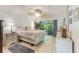 Bright and spacious bedroom with sliding glass doors leading to outdoor patio at 35 Misners Trl, Ormond Beach, FL 32174