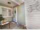 Welcoming front porch with a comfortable bench, stylish decor, and decorative door wreath at 35 Misners Trl, Ormond Beach, FL 32174