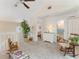 Bright and airy sitting area with vaulted ceilings, skylights, and comfortable rocking chairs at 35 Misners Trl, Ormond Beach, FL 32174