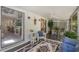 Cozy sunroom featuring seating, a ceiling fan, and view of the outside at 35 Misners Trl, Ormond Beach, FL 32174