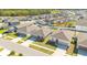Aerial view of the neighborhood showcasing the layout of homes with well-maintained lawns and consistent architectural design at 3761 Shoveler Ave, Leesburg, FL 34748
