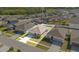 Aerial shot showcasing the home's layout and location within a well-planned neighborhood, highlighting the roof and driveway at 3761 Shoveler Ave, Leesburg, FL 34748
