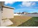 Expansive backyard featuring a white fence, ready for outdoor activities and entertaining under a blue sky at 3761 Shoveler Ave, Leesburg, FL 34748
