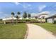 Scenic community area with a walking path, exercise equipment, and lush greenery creating a serene environment at 3761 Shoveler Ave, Leesburg, FL 34748