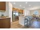 Modern kitchen with stainless steel appliances, granite countertops, and a breakfast bar at 3761 Shoveler Ave, Leesburg, FL 34748