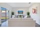 Living room featuring a comfy sofa, artistic decor, and sliding glass doors at 3761 Shoveler Ave, Leesburg, FL 34748