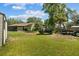 Expansive backyard with green lawn and UTV at 3790 Ne 22Nd Ave, Ocala, FL 34479