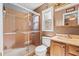 Bathroom featuring glass-enclosed shower, vanity, and neutral tile at 3790 Ne 22Nd Ave, Ocala, FL 34479