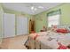 Comfortable bedroom with tile floors, natural light, and ample closet space at 3790 Ne 22Nd Ave, Ocala, FL 34479
