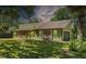 Charming single Gathering home with stone accents, a large lawn, and an attached garage at 3790 Ne 22Nd Ave, Ocala, FL 34479
