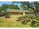 Well maintained single Gathering home with mature shade tree covering expansive front yard at 3790 Ne 22Nd Ave, Ocala, FL 34479