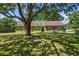 Well maintained single Gathering home with mature shade tree covering expansive front yard at 3790 Ne 22Nd Ave, Ocala, FL 34479