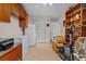 Bright kitchen with tile floors, wood cabinets, and functional storage space at 3790 Ne 22Nd Ave, Ocala, FL 34479