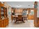 Eat-in kitchen featuring wood cabinets, stainless steel appliances, and a cozy breakfast nook at 3790 Ne 22Nd Ave, Ocala, FL 34479