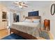 Comfortable bedroom with hardwood floors, closet, and a ceiling fan at 3790 Ne 22Nd Ave, Ocala, FL 34479