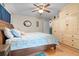 Comfortable bedroom with hardwood floors, built-in closet, and a ceiling fan at 3790 Ne 22Nd Ave, Ocala, FL 34479