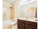 Full bathroom with tiled shower and tub combination and wooden vanity at 3812 Creswick Cir, Orlando, FL 32829