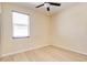A bright bedroom featuring vinyl wood flooring, a ceiling fan, and a window with blinds at 3812 Creswick Cir, Orlando, FL 32829