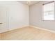 Bright bedroom featuring wood-look flooring, a chandelier and a window at 3812 Creswick Cir, Orlando, FL 32829