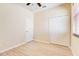 Bedroom with vinyl wood flooring, closet, a ceiling fan, and window with blinds at 3812 Creswick Cir, Orlando, FL 32829