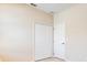A bedroom showing a closet, a door, light walls, and light colored vinyl wood flooring at 3812 Creswick Cir, Orlando, FL 32829