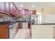 Updated kitchen with stainless steel appliances, granite countertops, and stylish tile backsplash at 3812 Creswick Cir, Orlando, FL 32829