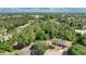 Overhead view of a property nestled among lush trees in a residential neighborhood, showcasing the home's location at 4 Starling Dr, Daytona Beach, FL 32117