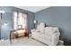 Comfortable living room with a sofa, desk, and window for a bright and inviting space at 4 Starling Dr, Daytona Beach, FL 32117