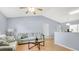 Bright living room features high ceilings, comfortable seating, and flows into the kitchen area with a breakfast bar at 4 Starling Dr, Daytona Beach, FL 32117