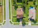 This aerial view displays a landscaped home with a fenced backyard in a suburban neighborhood at 4113 Longbow Dr, Clermont, FL 34711