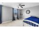Neutral bedroom with carpet floors, a ceiling fan, and a window with beautiful curtains at 4113 Longbow Dr, Clermont, FL 34711