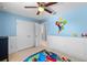Blue bedroom with cartoon decor and double door closet at 4113 Longbow Dr, Clermont, FL 34711