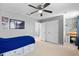 Charming bedroom featuring closet, desk, and blue and white accents at 4113 Longbow Dr, Clermont, FL 34711