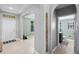 Spacious foyer featuring tile floors, archways, and views into other living spaces at 4113 Longbow Dr, Clermont, FL 34711