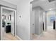 Hallway offering neutral paint, carpet, and access to multiple rooms at 4113 Longbow Dr, Clermont, FL 34711