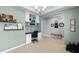 Open office space with coffered ceiling, built-in shelving, and neutral paint at 4113 Longbow Dr, Clermont, FL 34711