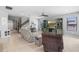 Bright and airy living room featuring neutral walls and staircase access at 4113 Longbow Dr, Clermont, FL 34711