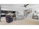 Open-concept living room with seamless flow to the kitchen and staircase at 4113 Longbow Dr, Clermont, FL 34711