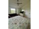 Bright bedroom with window and ceiling fan at 4244 Sun Village Ct # 160, New Smyrna Beach, FL 32169