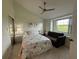 Upstairs bedroom with window and ceiling fan at 4244 Sun Village Ct # 160, New Smyrna Beach, FL 32169