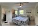 Bedroom with window, ceiling fan, and a TV at 4244 Sun Village Ct # 160, New Smyrna Beach, FL 32169