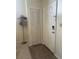 Inviting entryway with closet, a front door with modern lock, hat stand, and neutral decor at 4244 Sun Village Ct # 160, New Smyrna Beach, FL 32169