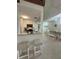 Open-concept kitchen with granite countertops, stainless appliances, and ample counter seating at 4244 Sun Village Ct # 160, New Smyrna Beach, FL 32169