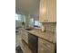 Bright kitchen featuring modern cabinets, granite counters, and stainless steel appliances at 4244 Sun Village Ct # 160, New Smyrna Beach, FL 32169