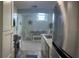 Galley kitchen and dining area with stainless steel appliances and white cabinets at 4244 Sun Village Ct # 160, New Smyrna Beach, FL 32169