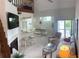 Spacious living room, fireplace, and stairway at 4244 Sun Village Ct # 160, New Smyrna Beach, FL 32169