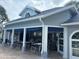 Community pool house with tables, chairs, shade, and awnings at 4244 Sun Village Ct # 160, New Smyrna Beach, FL 32169