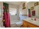 Bathroom featuring a shower over tub and a wood vanity at 4381 Creekside Blvd, Kissimmee, FL 34746